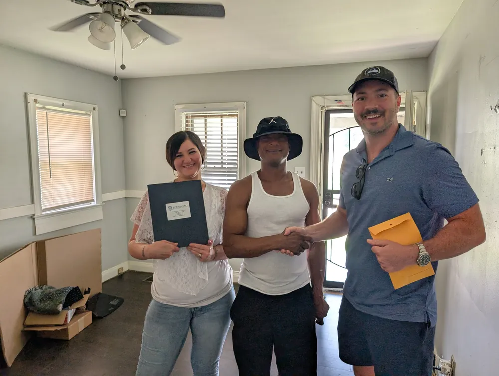 Closing day at a Louisville house with the seller and the title agent